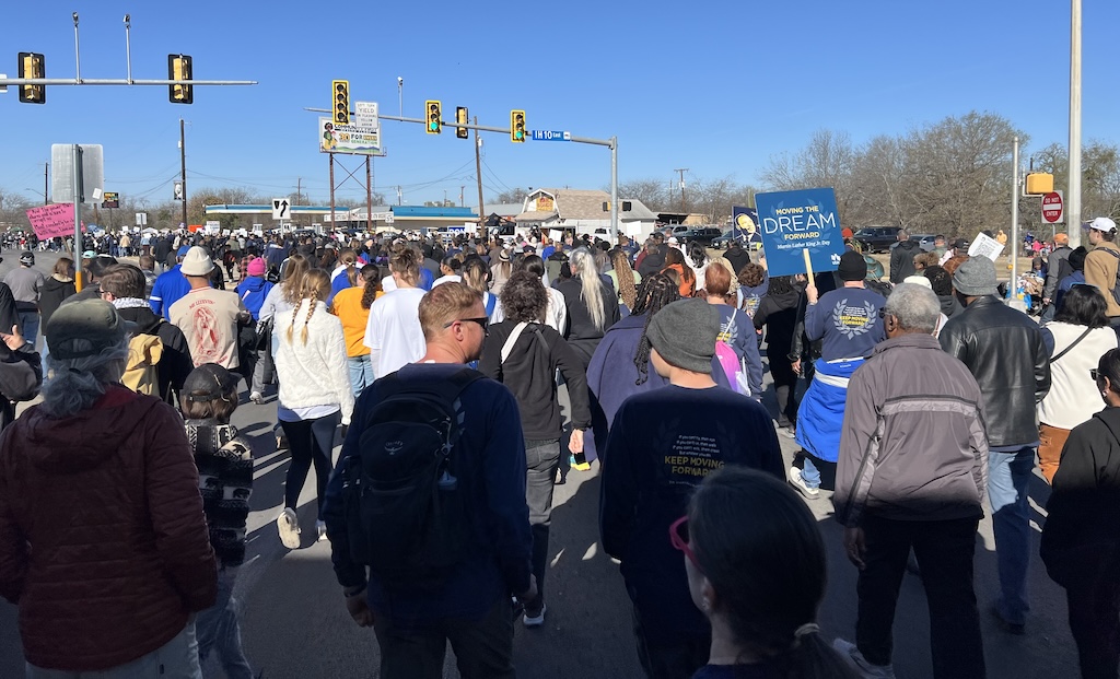 Crowd of marchers filling the street at San Antonio's 39th annual MLK Jr. march